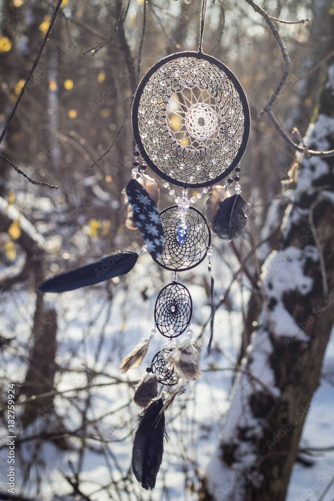 Dreamcatcher made of feathers, leather, beads, and ropes Dreamcatcher made of feathers, leather, beads, and ropes
