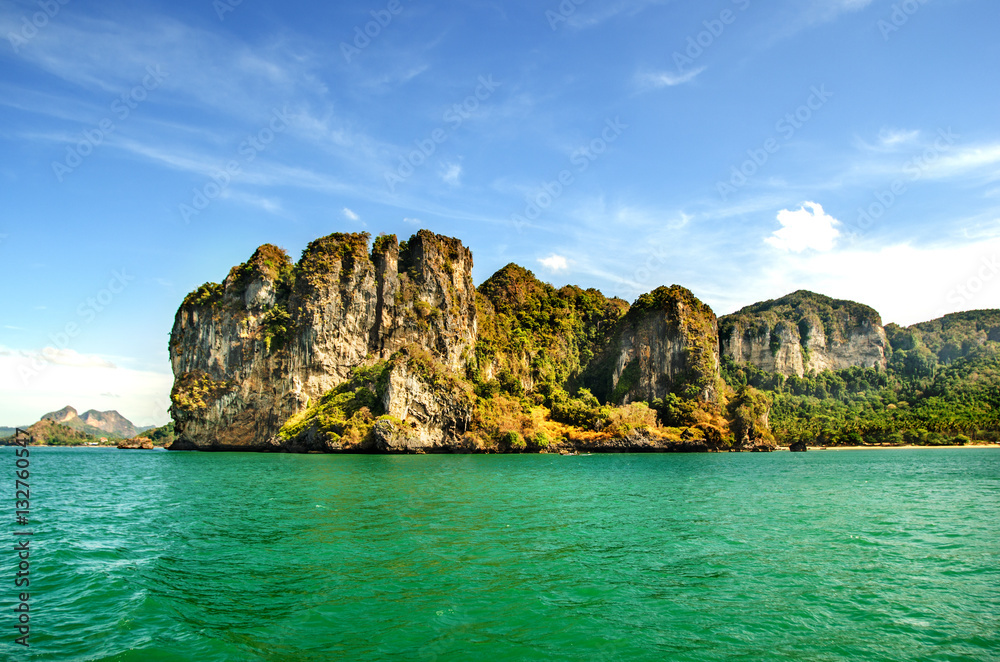 Ocean, limestone rocks and blue sky in Thailand