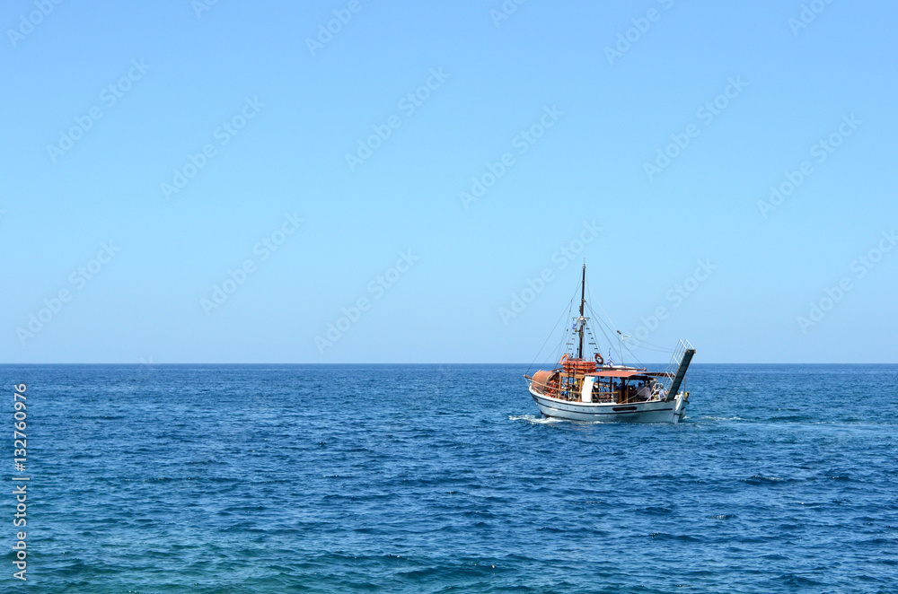 Boat in the sea on backgrounf od blue sky Boat in the sea on backgrounf od blue sky