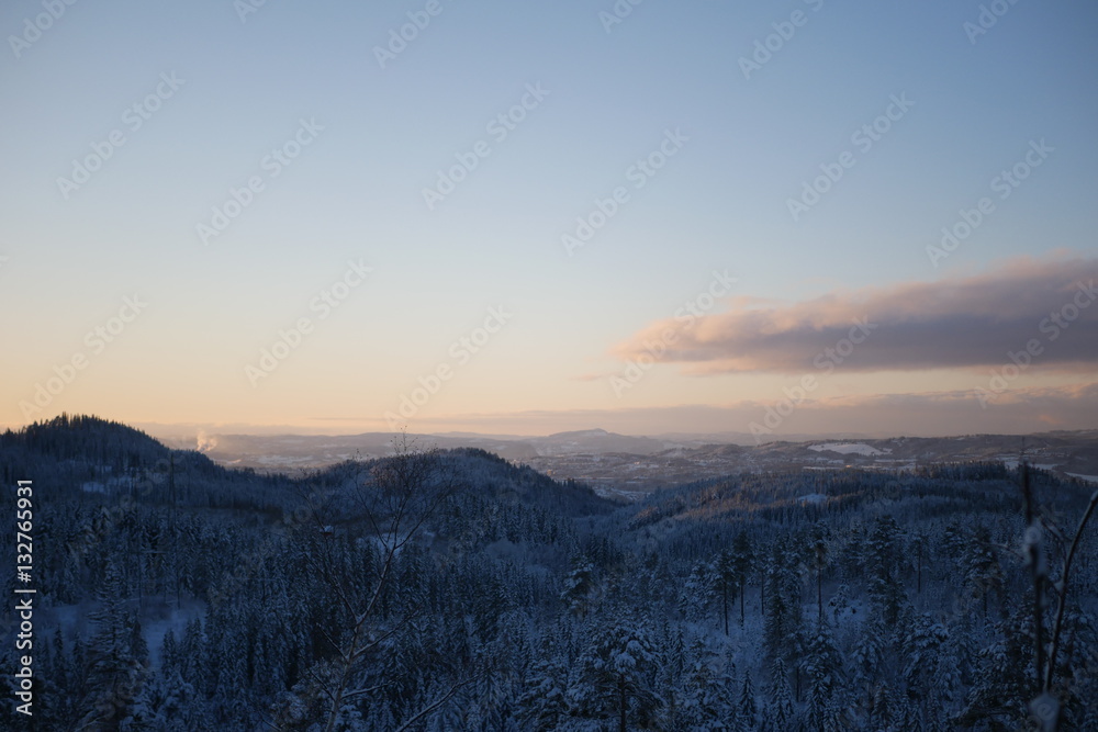 Snow covered landscape in beautiful sunset
