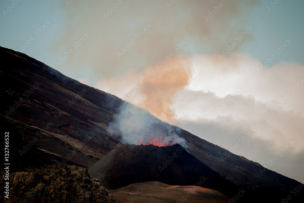 Ile de la reunion island Piton de la fournaise volcano eruption with lava flow and steam