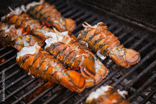 Freshly grilled delicious lobsters. Lobster bbq, no claws. Street food.
