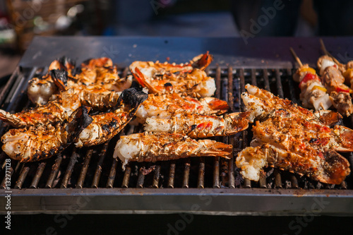 Freshly grilled giant lobsters. Lobster bbq  no claws. Street food.