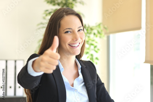 Businesswoman posing with thumbs up