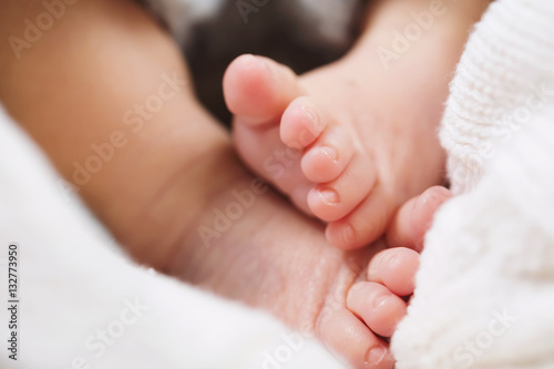 Baby feet peaking out of a blanket