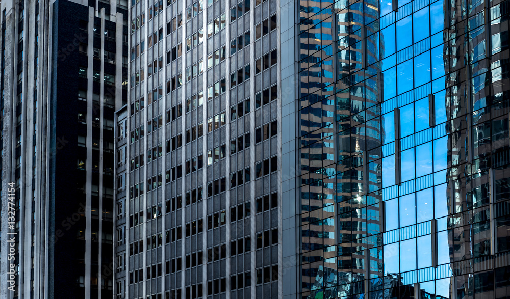 Office buildings stretch up to the blue sky in hong kong