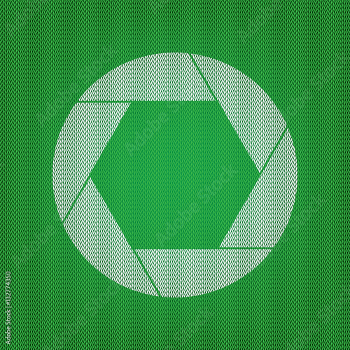 Photo sign illustration. white icon on the green knitwear or woo