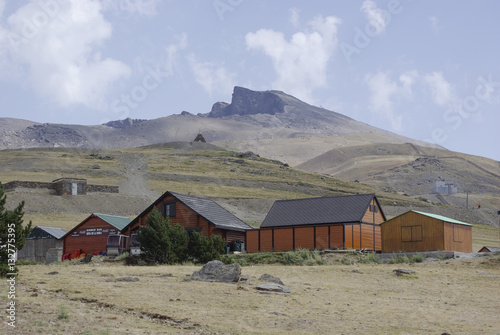 Wooden huts in Sierra Nevada, the highest peaks of inland Spain. photo