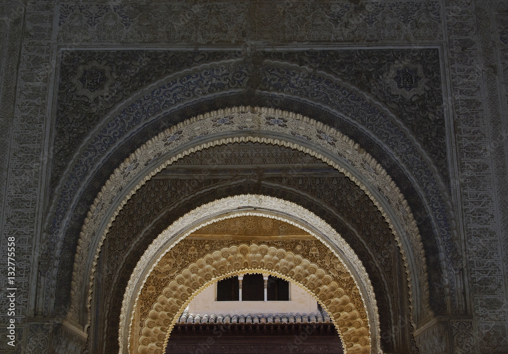 Fine decorations on the walls of Alhambra palace.