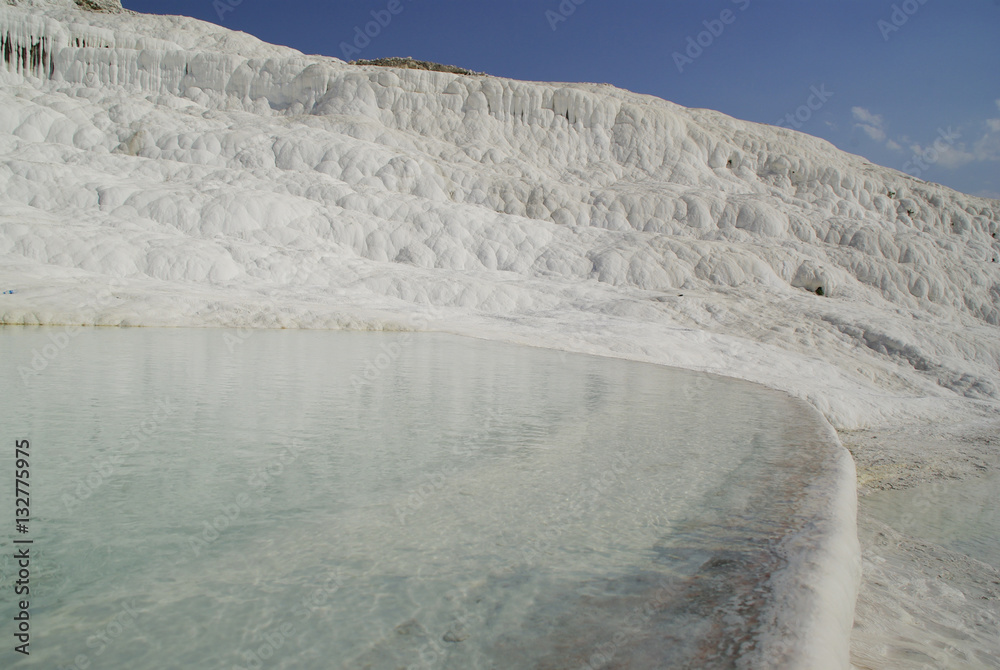 Fototapeta premium The calcium carbonate terraced water pools of Pamukkale, the 