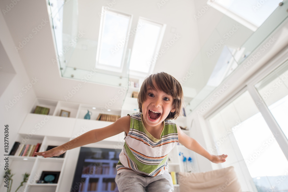 Happy cute little boy at new modern home Happy cute little boy at new modern home