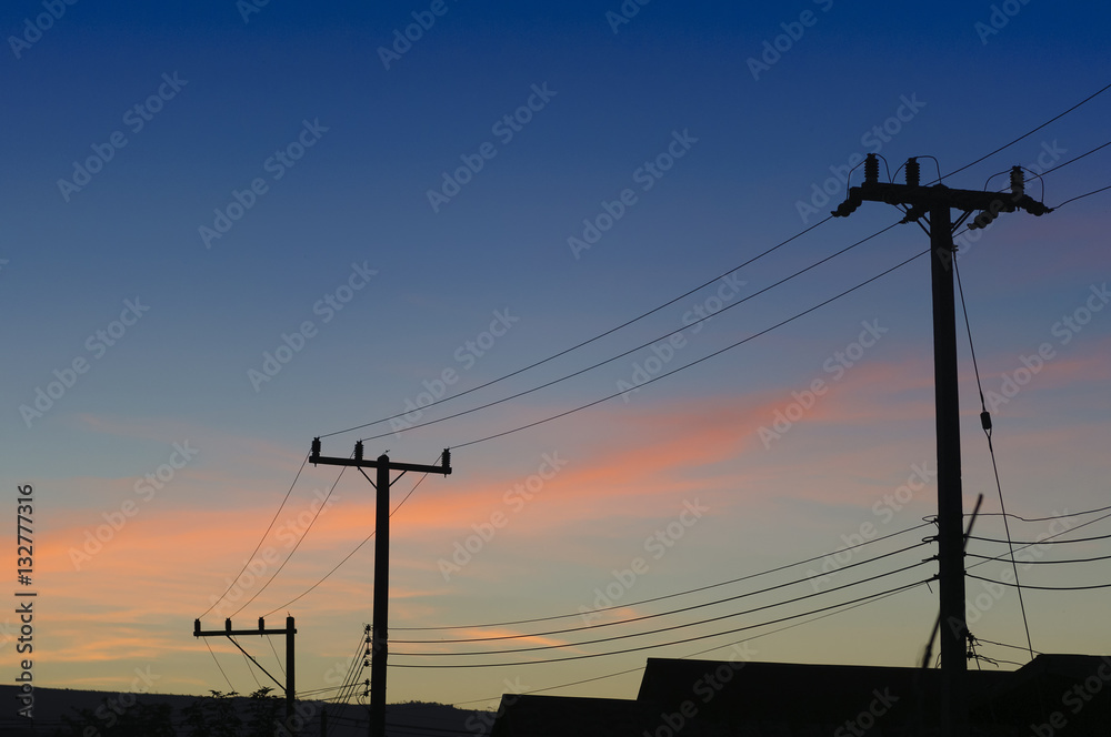 The silhouette  of electricity pole with the twilight scene