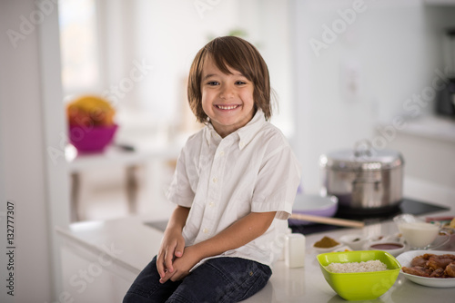 Cute adorable little boy in the kitchen