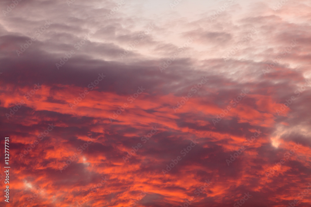 Colorful warm clouds on sky at sunset