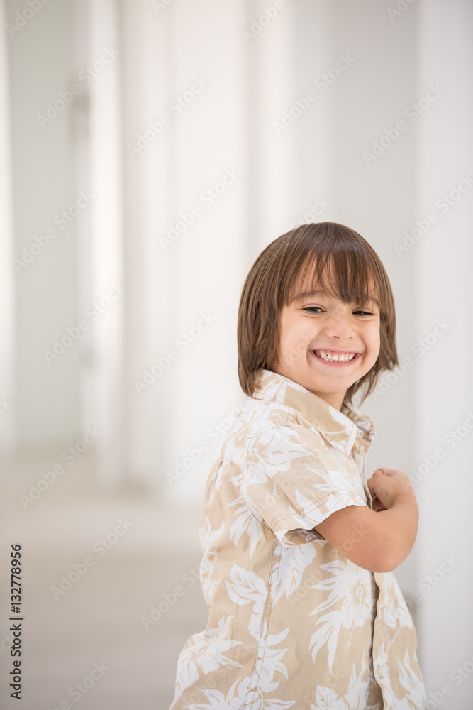 Cute school kid posing in studio with different facial expressio Cute school kid posing in studio with different facial expressio