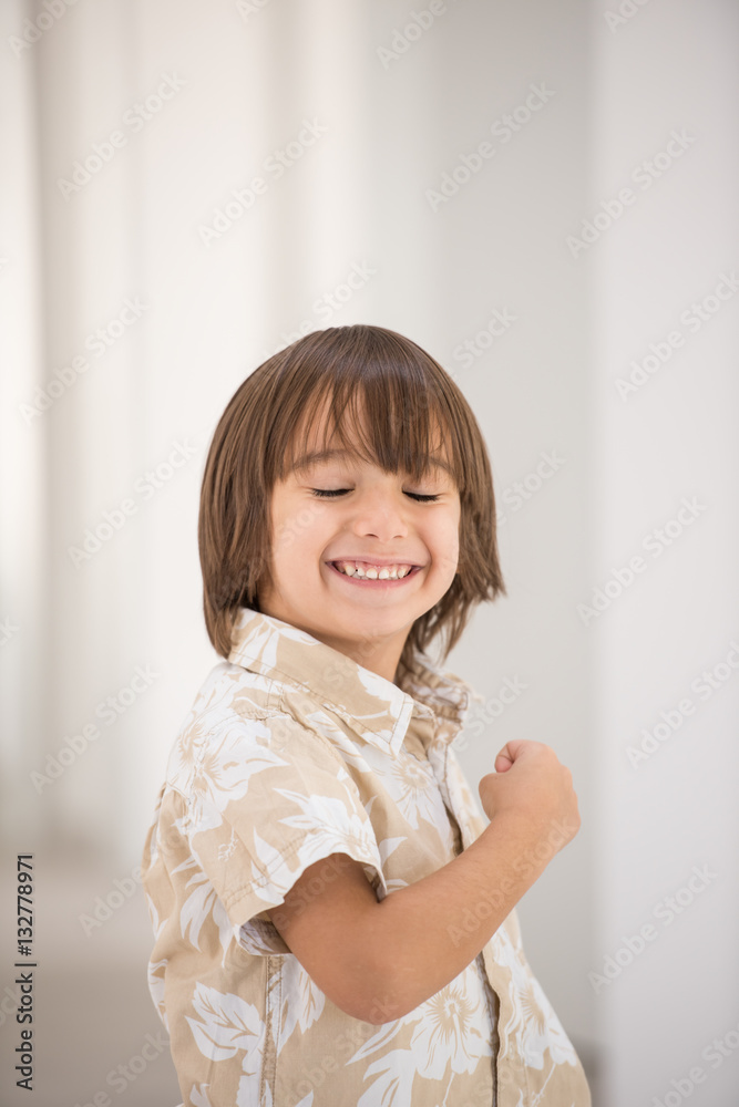 Cute school kid posing in studio with different facial expressio Cute school kid posing in studio with different facial expressio