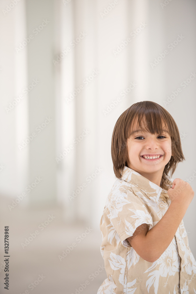 Cute school kid posing in studio with different facial expressio Cute school kid posing in studio with different facial expressio