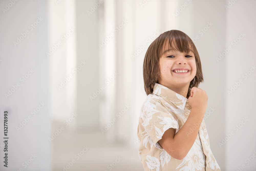 Cute school kid posing in studio with different facial expressio Cute school kid posing in studio with different facial expressio