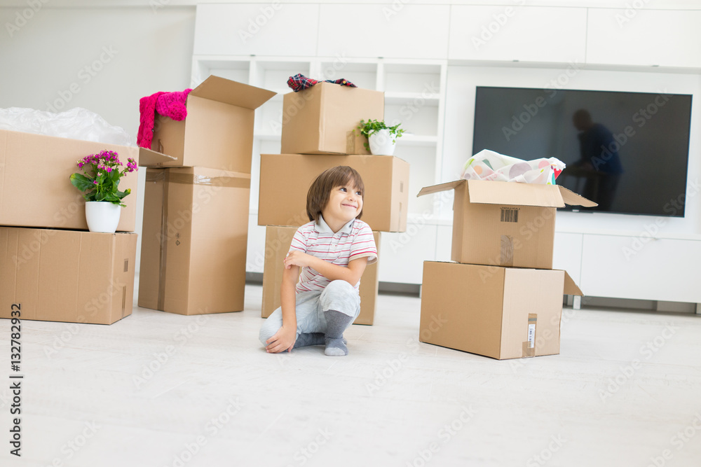 Happy kids with boxes at new modern home Happy kids with boxes at new modern home