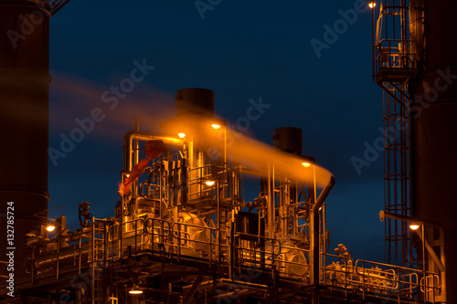 Close-up Oil and Gas Refinery tower in petrochemical industrial plant with blue sky