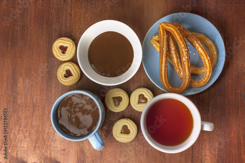 Churros, traditional Spanish dessert, with chocolate and tea