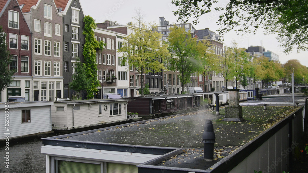 Smoke from houseboats along canals, Amsterdam, Netherlands