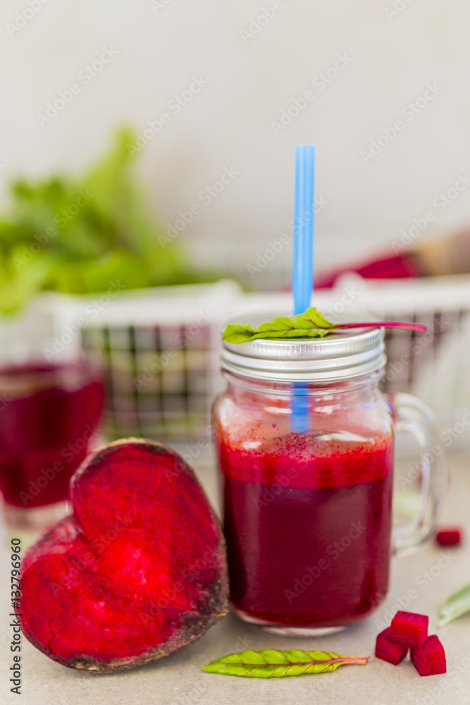 Healthy beetroot smoothie in a mason jar mug on grey stone background. Healthy beetroot smoothie in a mason jar mug on grey stone background.