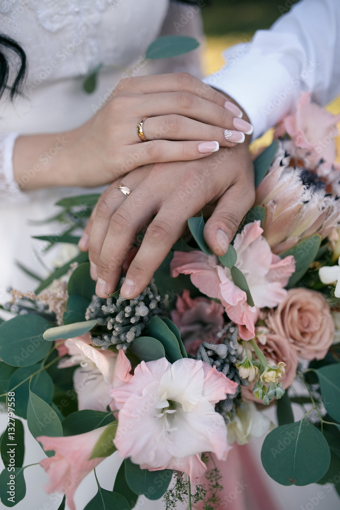 hands of bride and groom with wedding rings hands of bride and groom with wedding rings