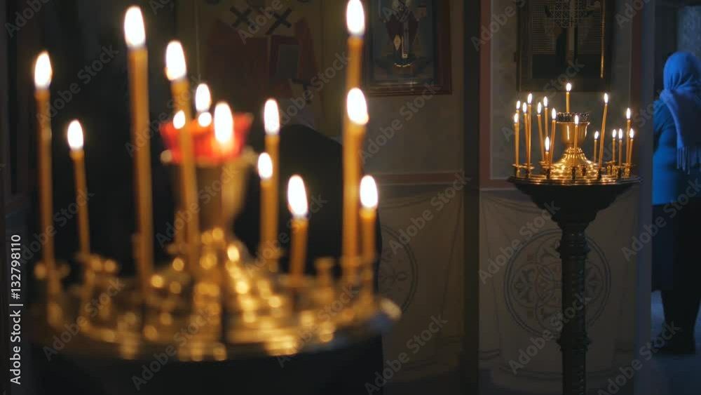 Burning candles in an Orthodox Church. Icons and prayer. Burning candles in an Orthodox Church. Icons and prayer.
