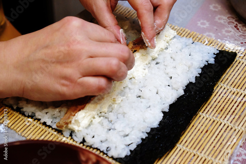 the process of cooking sushi and rolls
