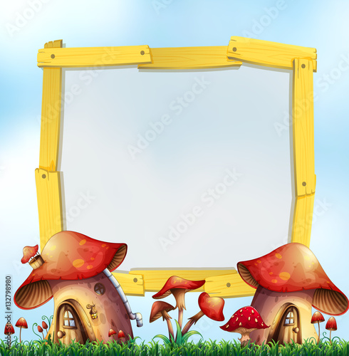 Wooden frame with mushroom houses in garden