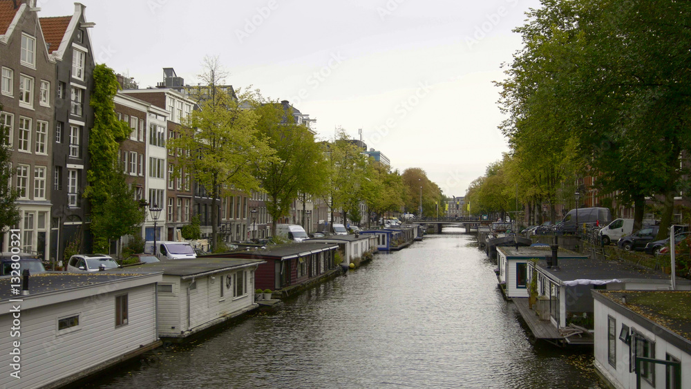 Vessels and houseboats along canals, Amsterdam, Netherlands