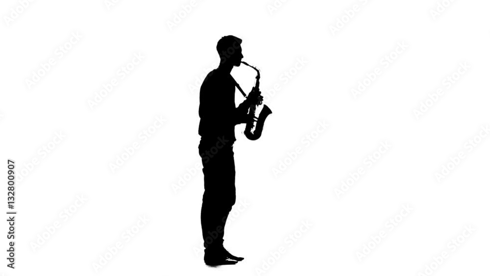 Silhouette of a man playing the saxophone standing sideways Silhouette of a man playing the saxophone standing sideways