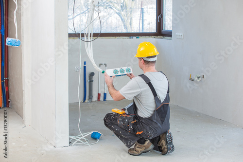 Electrician  Installing  Socket

 photo