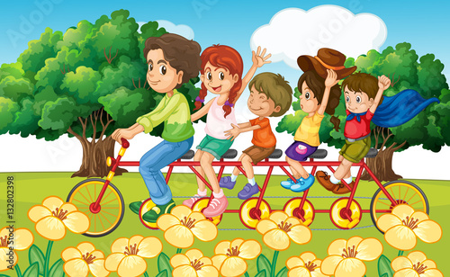 Fototapeta Naklejka Na Ścianę i Meble -  Parents and children riding bike in the park