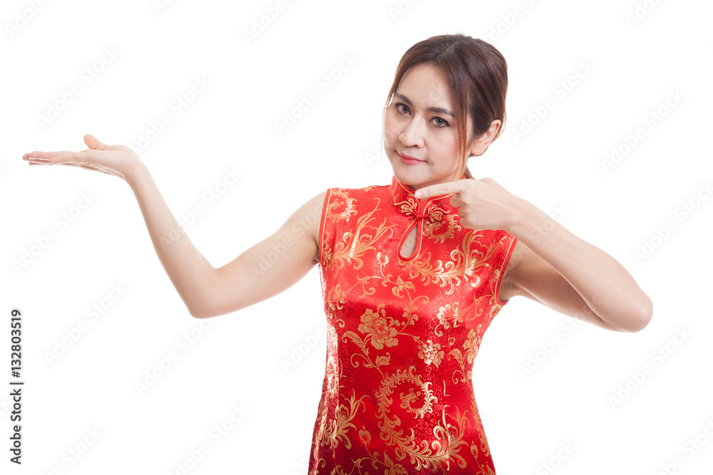 Asian girl in chinese cheongsam dress point to blank space on h Asian girl in chinese cheongsam dress point to blank space on h
