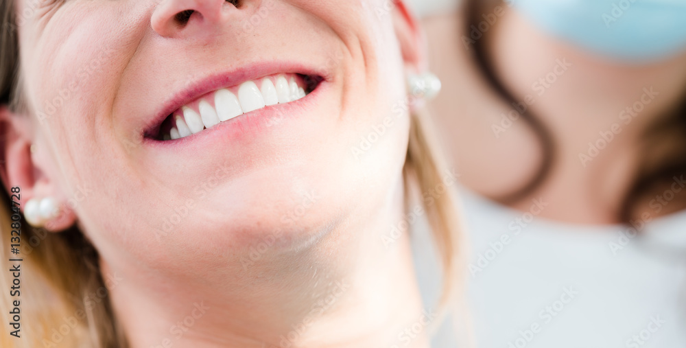 Fototapeta premium Woman with healthy smile at dentist