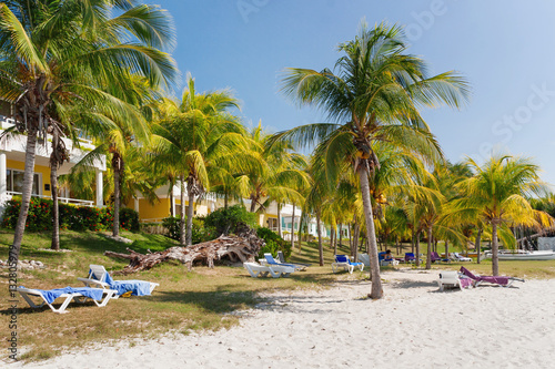 Tourists relax on Varadero sandy beach. Cuba.