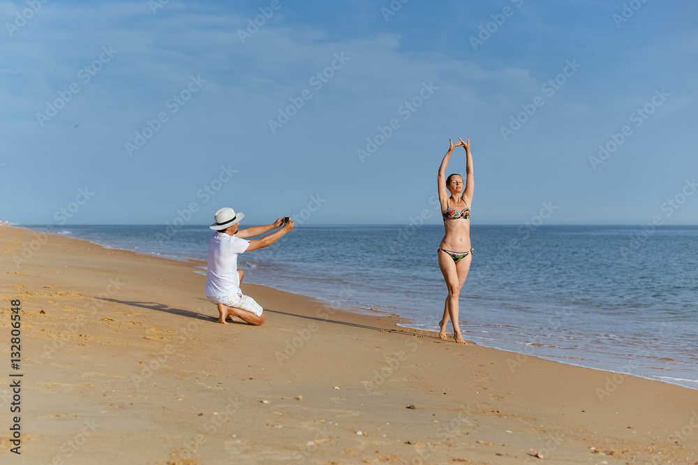 Couple in love on beach outdoor background, back view image. Valentines day travel vacation lifestyle Couple in love on beach outdoor background, back view image. Valentines day travel vacation lifestyle