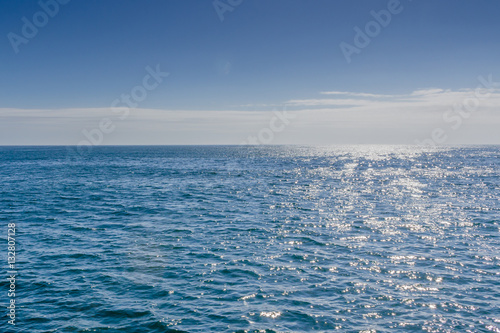 Blue sea with sunlight reflected on it