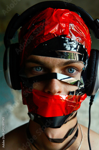 Music makes my identity in world of total mess. Man's face lost photo