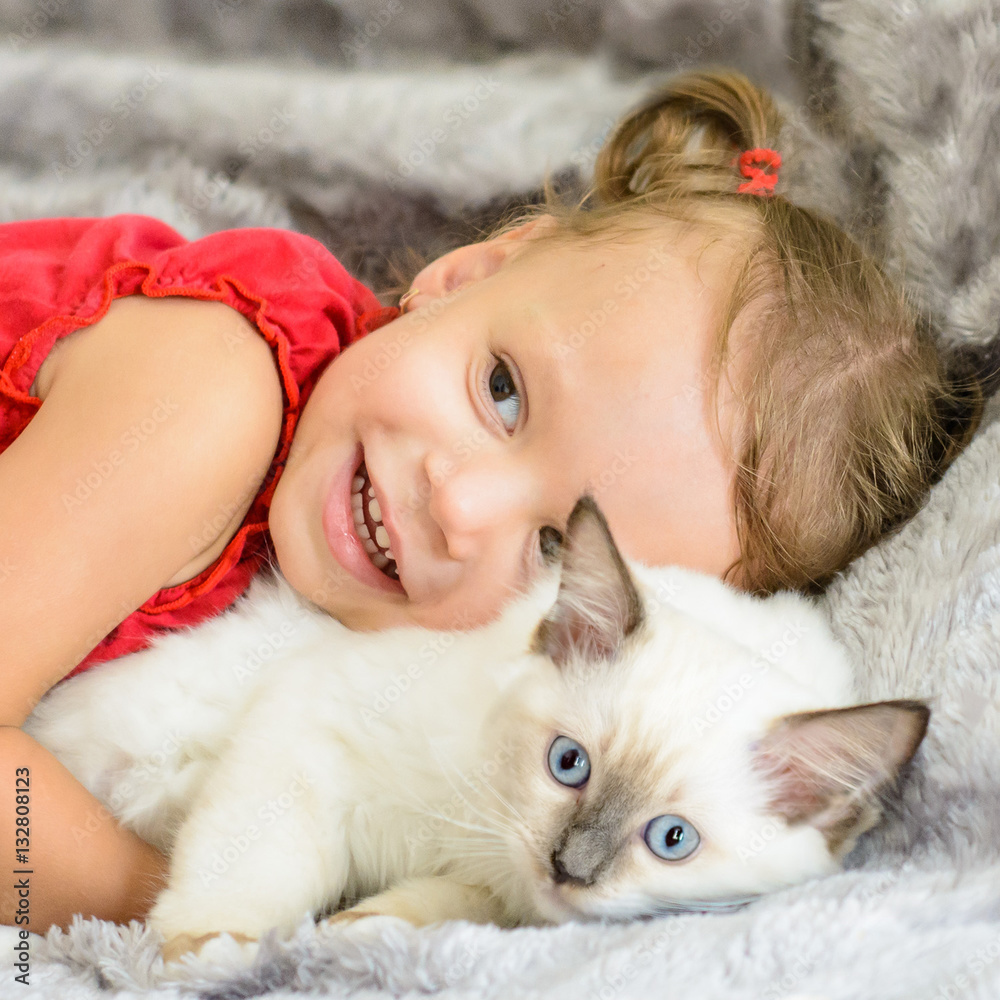 Cute girl hugging kitten Cute girl hugging kitten