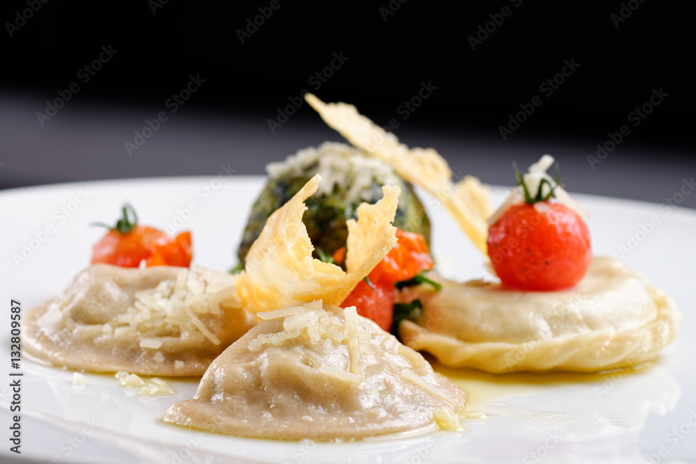 Bavarian bread dumplings served on a white platter, garnished with parsley