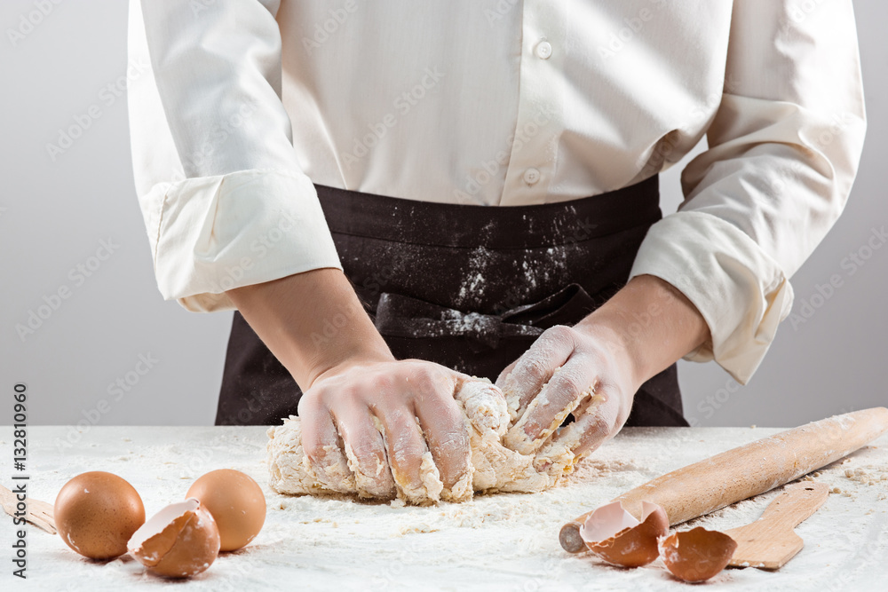 Hands kneading a dough Hands kneading a dough