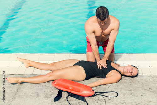 Lifeguard doing resuscitation procedure