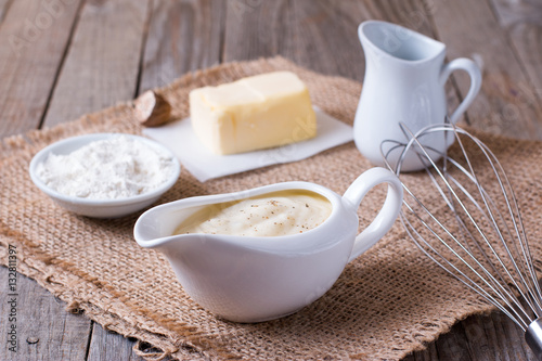 Tableau sur toile Bechamel sauce on kitchen table