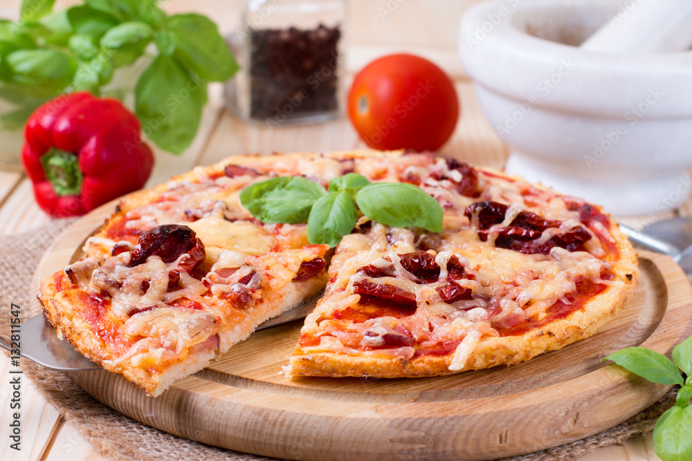 Delicious fresh pizza on wooden background Delicious fresh pizza on wooden background