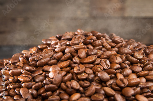 Heap of hot roasted coffee beans with steam