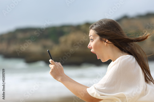 Amazed girl with her smart phone