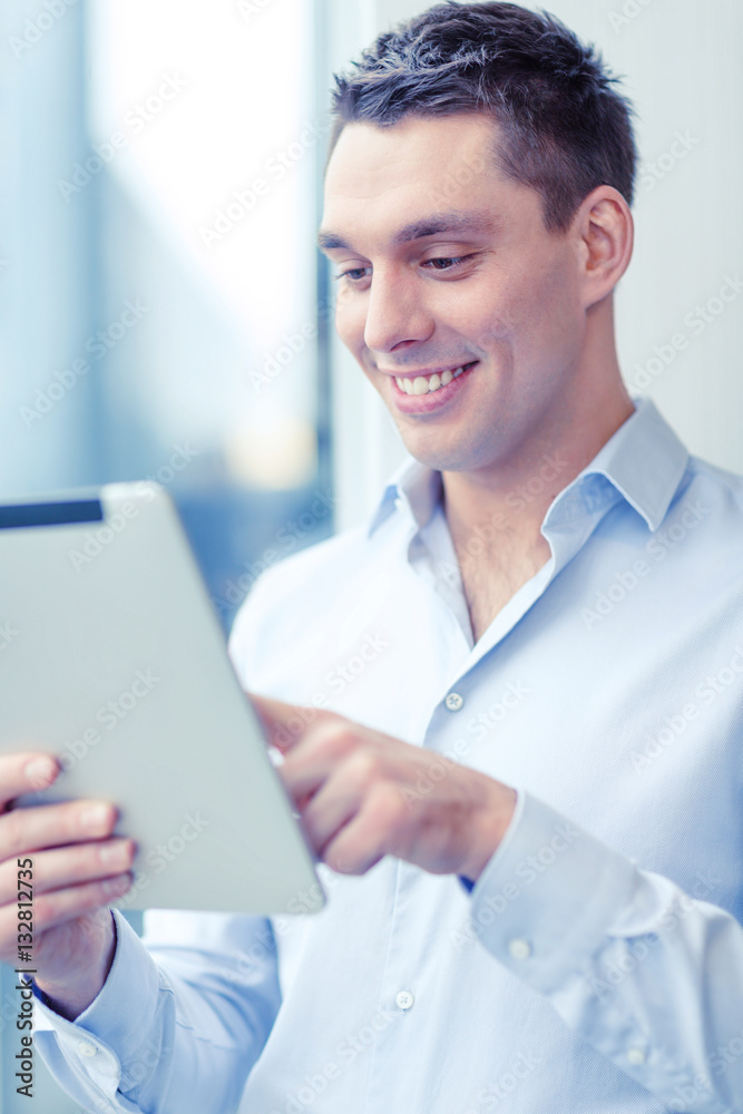 smiling businessman with tablet pc in office smiling businessman with tablet pc in office